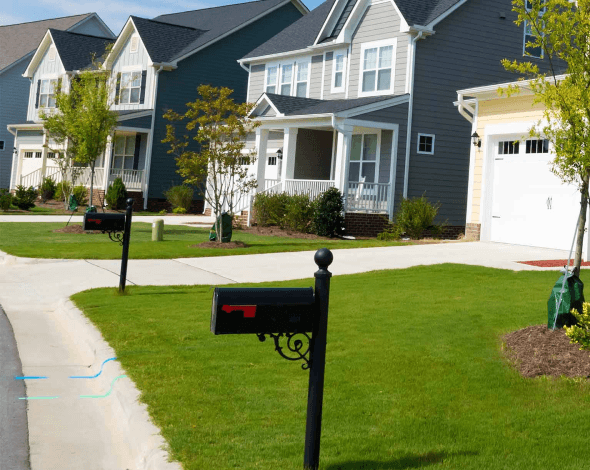 Neighborhood with mailboxes and neighbors. 